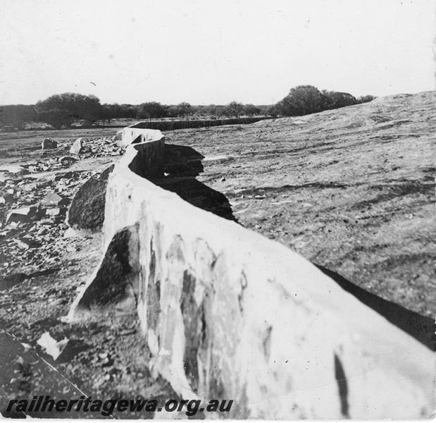 P19654
Rock contour wall on the rock catchment for the railway dam at Coongoo on the Mullewa - Cue section, NR line
