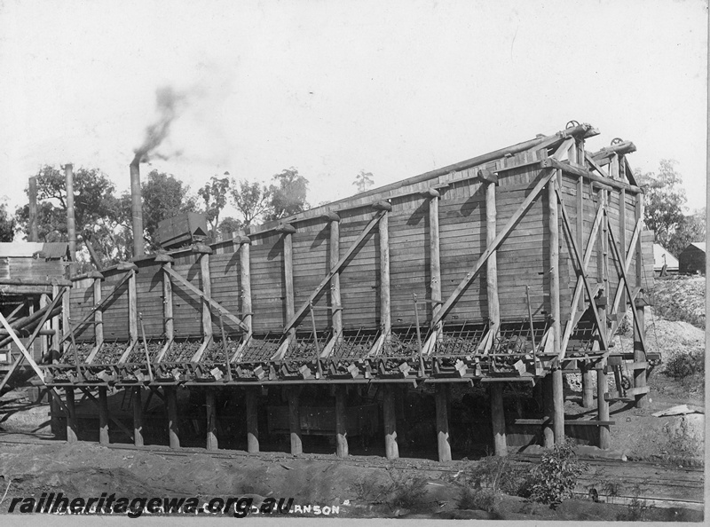 P19683
Allanson - Westralian Coal Mining Co rail coal loader. Side view showing loading chutes. BN line.

