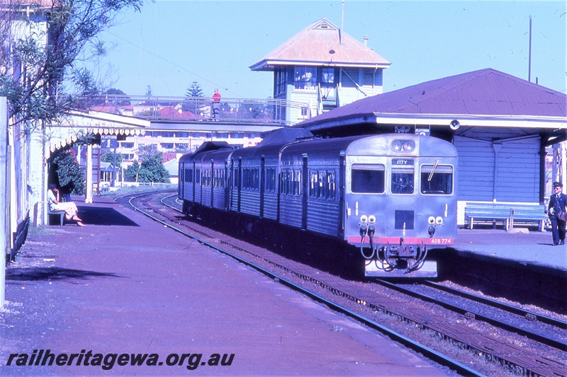 P19707
ADB class 774, leading 4 car DMU set, platforms, station buildings, pedestrian overpass, signal box, Claremont, ER line, view towards west
