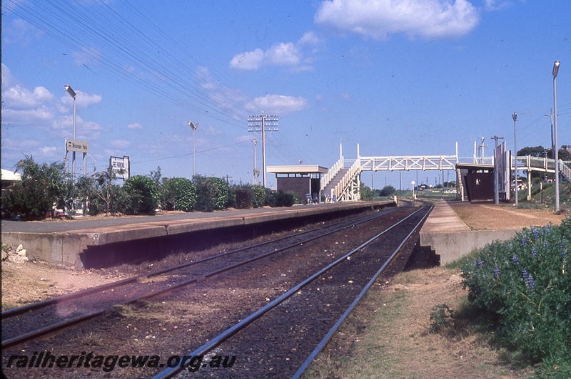P19709
Platforms, shelters, pedestrian footbridge, station nameboards, Mosman Park, ER line, track level view
