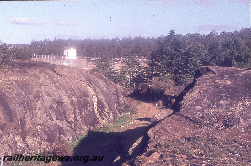 P19721
Weir wall, rotunda on dam wall, granite outcrops, dirt track leading to weir, Mundaring Weir, MW line
