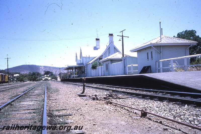 P19757
Platform, station buildings, points, point lever, rodding, track, vans, York, GSR line, track level view
