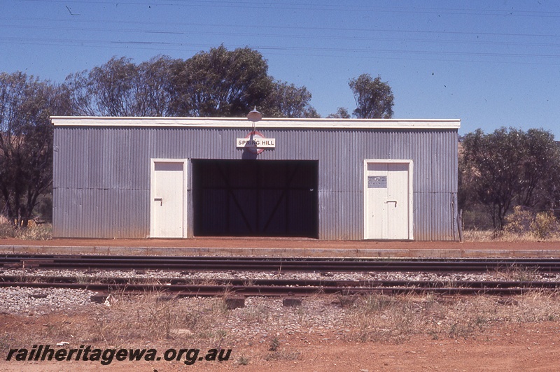 P19771
Station building, station nameboard on building, platform, tracks, Spring Hill, ER line, view of station building from opposite side of tracks
