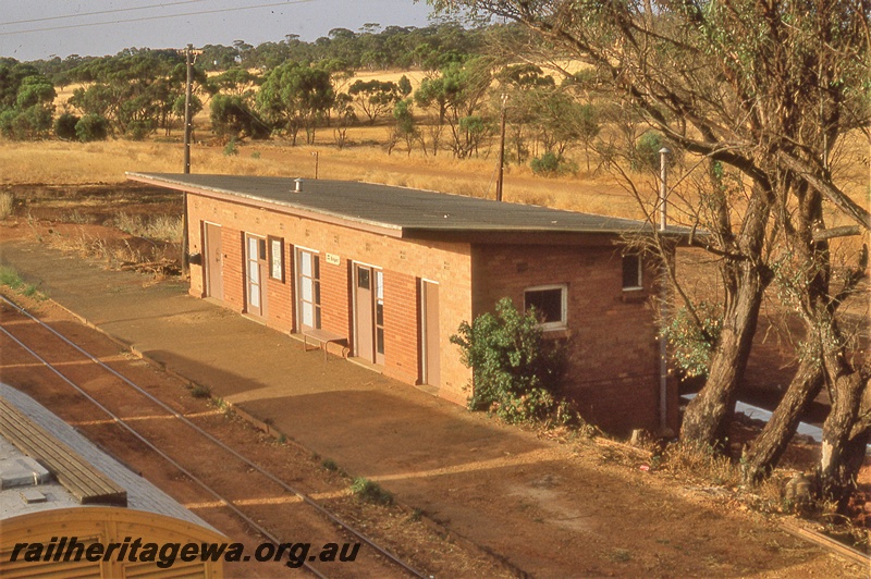 P19792
Station building, platform, station nameboard on building, track, van (part roof), Bolgart, CM line
