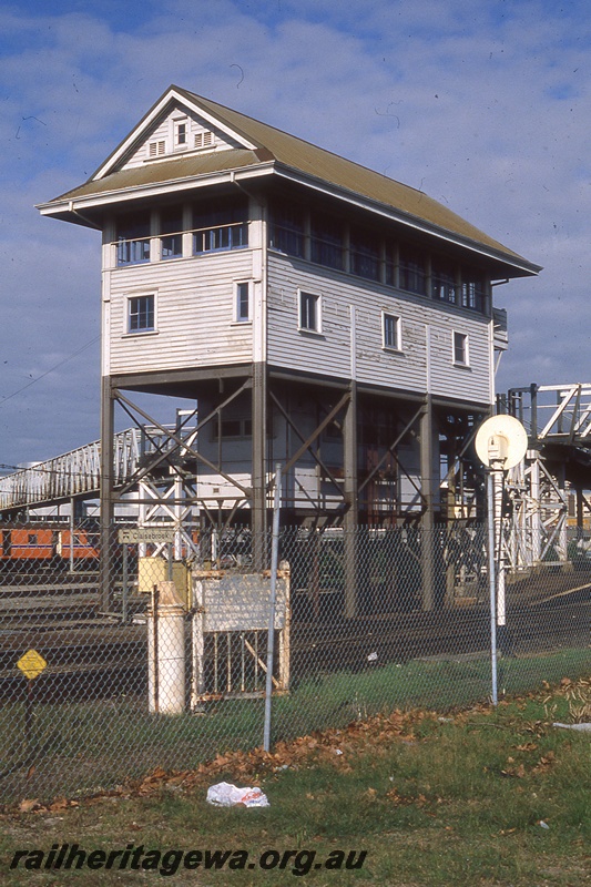 P19814
Signal box, light signal, platform end, station nameboard, DMU set passing, pedestrian footbridge, Claisebrook, ER line, end and side view 
