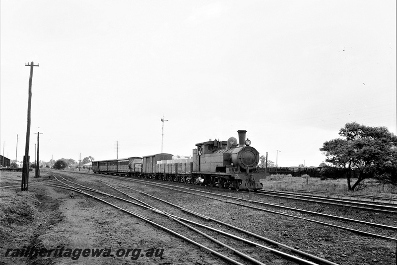 P19895
N class 73 approaching Midland Junction hauling a mixed train. 4 side door coaches at rear of train. ER line. 
