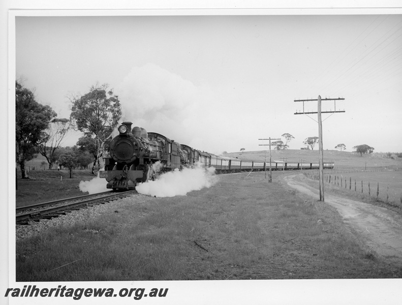 P20004
PR class 523, with another steam loco, double heading passenger train, rural setting, front and side view
