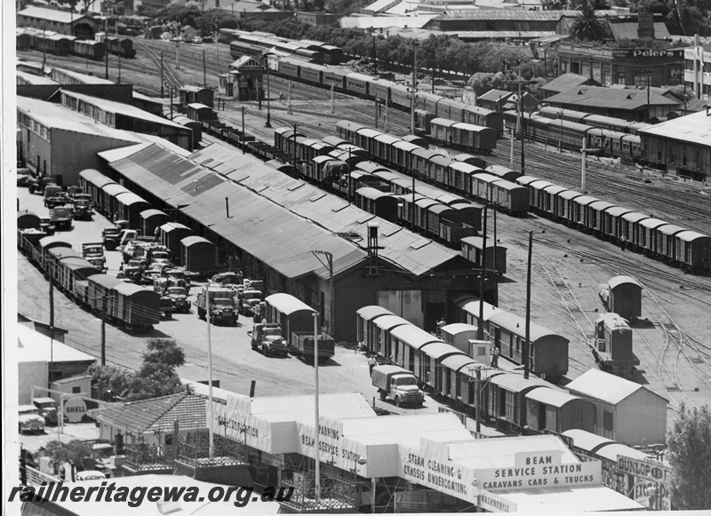 P20020
Overview of Perth goods yard, two Y class diesels shunting, numerous rakes of vans and wagons including three D class advertising vans in bottom right of picture, two of which have 