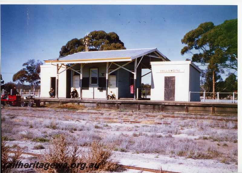 P20050
Gangers trolley with trailer, station building under an overall canopy roof, Out of Sheds, fire hose box on a pole, nameboard, Yellowdine, EGR line, view across the yard.
