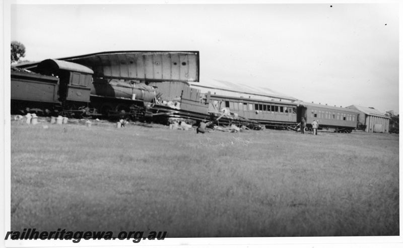 P20074
Scene of collision when No 6 passenger train ran into No 8 from Albany to Perth ES class 336, under remains of ZJ class 360, other passenger carriages, wheat bin, onlookers, Mount Kokeby, GSR line 
