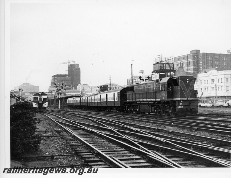 P20094
D class 1563, on passenger train departing Perth city station, DMU railcar set, signals, bracket signals, scissors crossover, city skyline, ER line, side and front view
