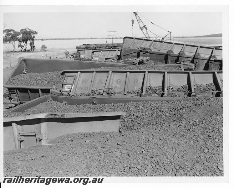 P20166
Derailment of loaded iron ore train near Southern Cross. Photo shows several rolled over WO class wagons and track damage. EGR line.
