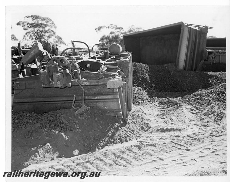 P20169
Derailment of loaded iron ore train near Southern Cross. Photo shows several rolled over WO class wagons and track damage. EGR line.
