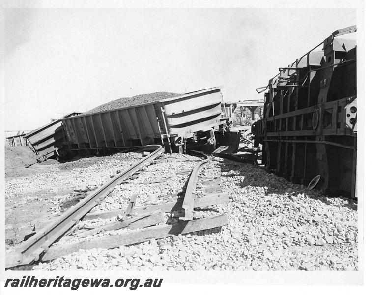 P20171
Derailment of loaded iron ore train near Southern Cross. Photo shows several rolled over WO class wagons and track damage. EGR line.
