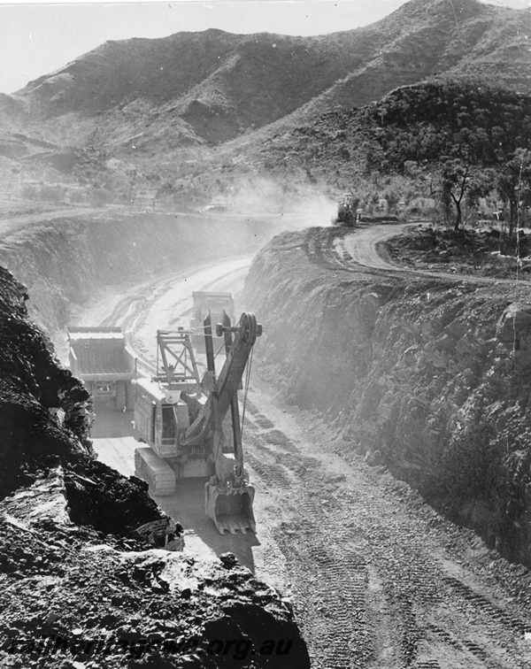 P20201
Iron ore railway construction, cutting excavation, excavator, truck, machine, mountains, Pilbara, view down into cutting
