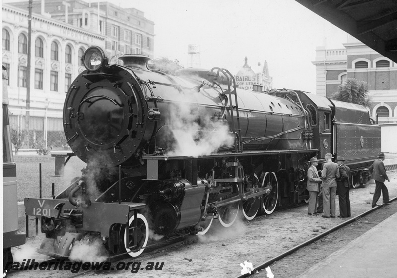 P20215
V class 1201, onlookers, part station building, retail and commercial premises in background, Perth station, ER line, front and side view
