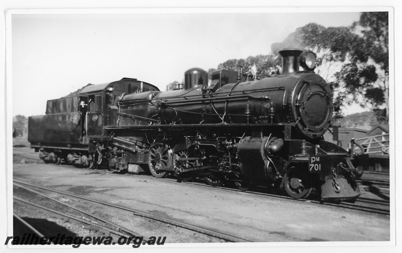 P20217
PM class 701, first of the new class, at Northam station on 12/1/1950. Front three-quarter view of right hand side, showing original air-operated sanding control and also Cardew cylinder relief valves mounted to side of smokebox. ER line
