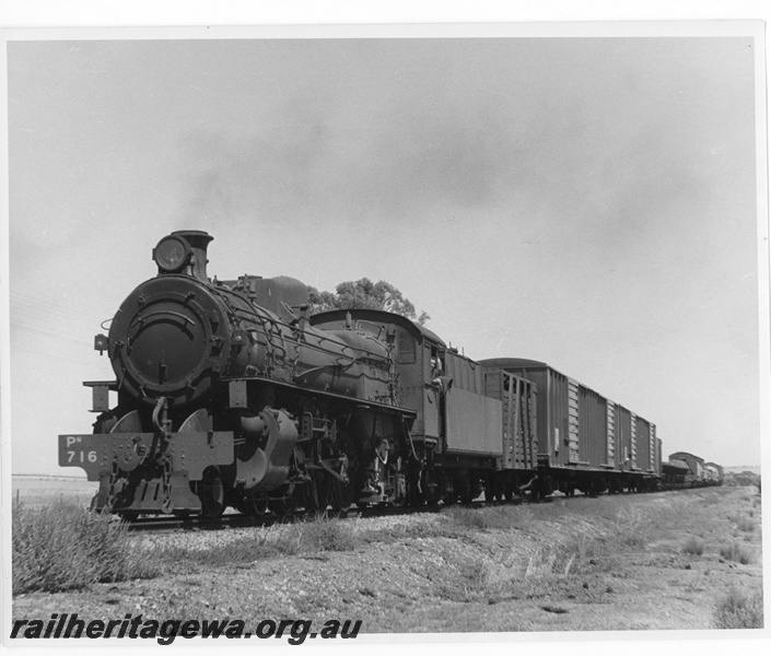 P20220
PM class 716 hauling No.103 goods from Avon to Merredin via Dowerin. Train includes Commonwealth Railways VE class vans, built by Comeng in Bassendean, on narrow gauge transfer bogies. EM line.
