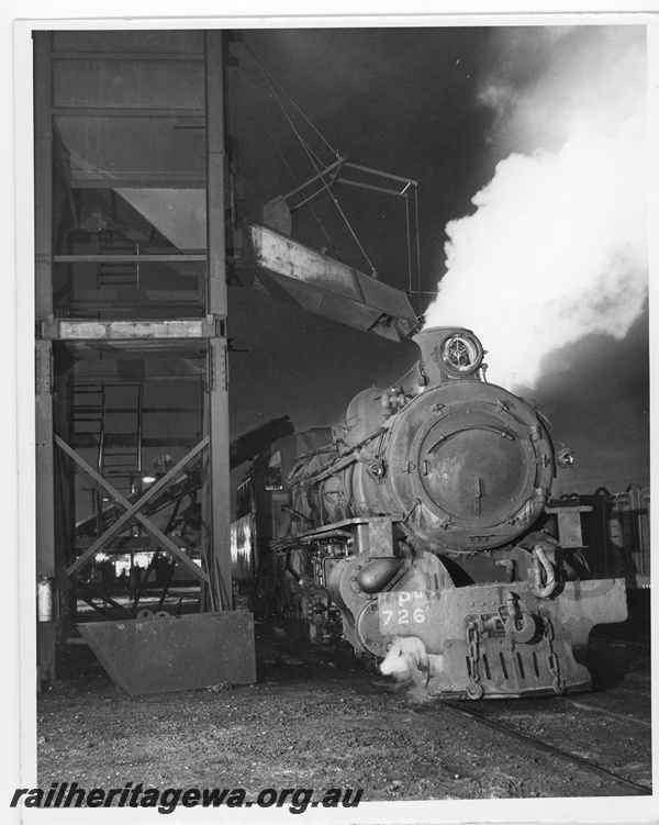 P20230
PM class 726 under coaling plant at East Perth loco depot. Night photograph using flash.
