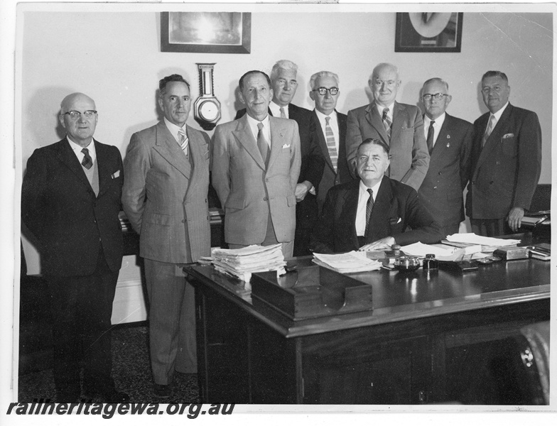 P20239
Group photo of the office bearers of the WAGR. Seated C. G. C. Wayne (Commissioner). Standing left to right, J. Bradley (Chief Mechanical Engineer), C. J. T. Eivers (Secretary for Railways), T. Marsland (ex Commissioner), A. E. Moyle (Chief Traffic Manager), C. C. Gates (Comptroller of Stores), C. R. A. Stewart (Chief Civil Engineer), C. A. Robinson (Chief Finance & Executive Officer, J. N. Turner (Comptroller of Accounts & Audit)
