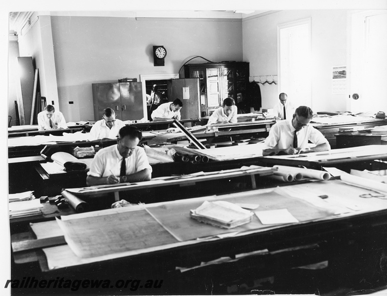 P20265
Interior of Drawing Office at Midland Workshops No 2 of 3, drawing boards, drawings, draughtsmen at work, clock, view from front of the office
