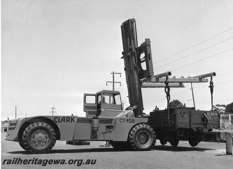 P20267
HC class wagon 21470, being lifted by Clark large forklift truck, No CY450, Claremont yard, ER line, side view

