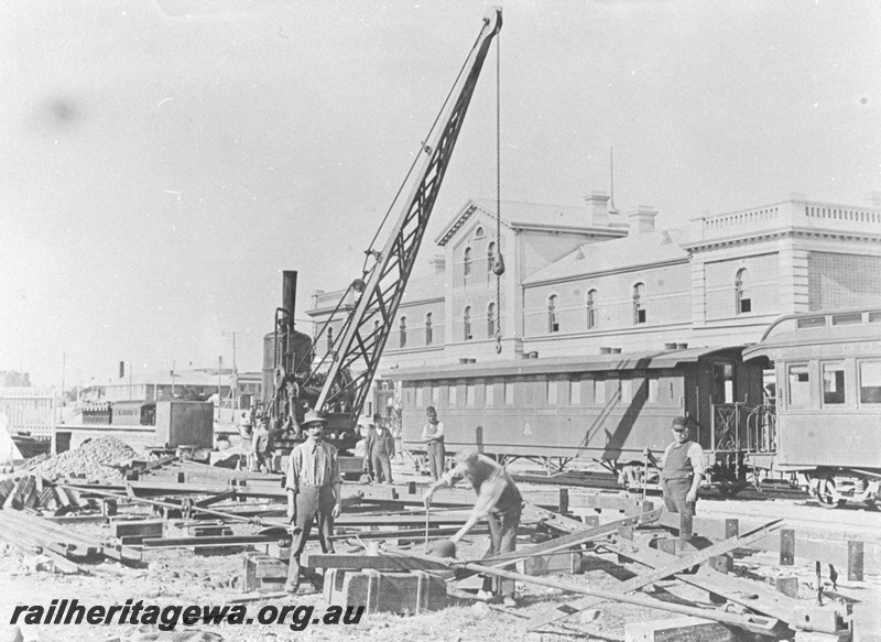 P20283
Perth Railway Station - workmen constructing station canopy roof. AG class passenger coach in background. ER line

