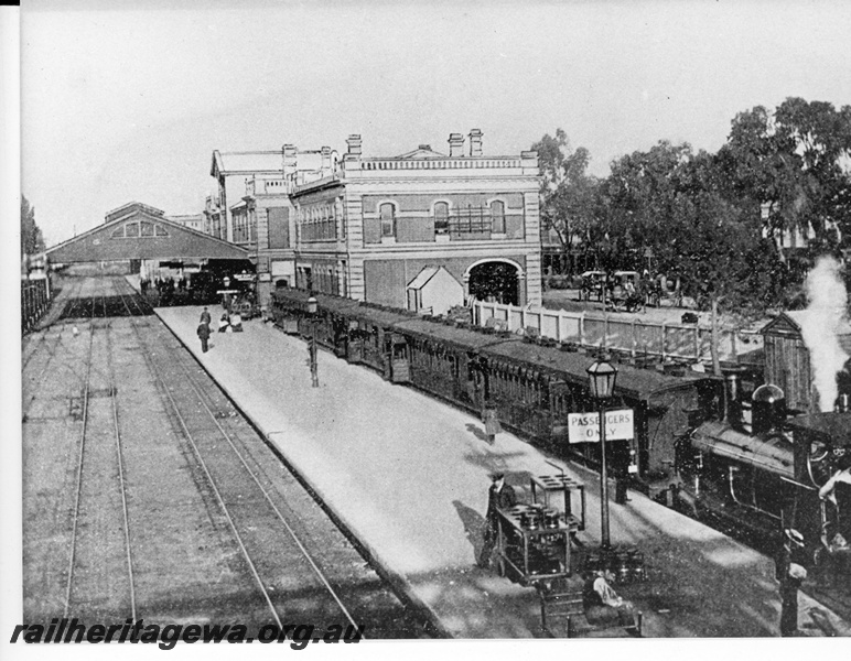 P20296
Perth Railway Station- view looking east shows G class on a Fremantle bound passenger train in the Fremantle dock, the station building and shelter covering  3 mainline tracks.  ER line.
