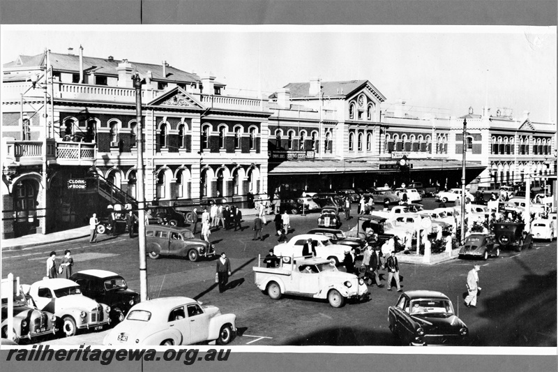 P20337
Busy scene at front of Perth station, station building, station clock, car park, motor vehicles, pedestrians, view from elevated position 
