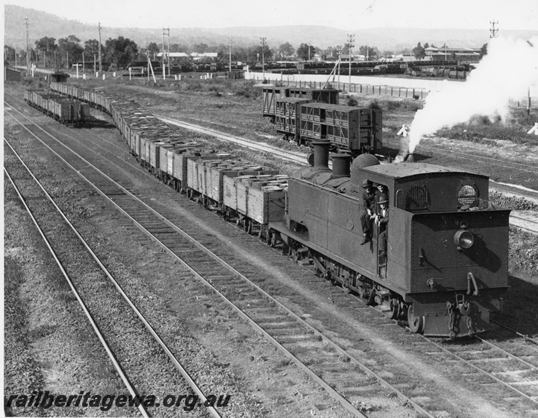 P20364
K class 37 entering Midland (then Midland Junction) from south-east hauling train of open wagons containing 44 gallon drums, trailing a clerestory-roof brakevan. Crew appear to be posed for photo. ER line
