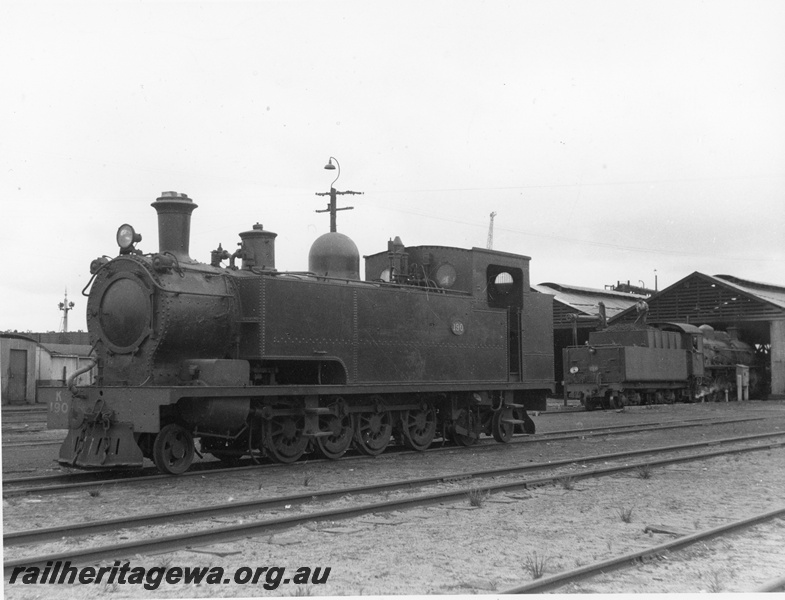 P20372
K class 190 at unidentified loco shed. Probably stored - note weighted cap on funnel.
