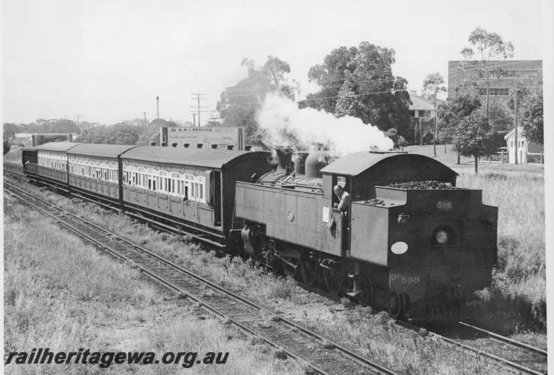 P20382
DD class 598 hauling passenger train between Subiaco and Daglish, towards Claremont. Note white disk indicating a special working for Royal Show traffic. Building in background is King Edward Memorial Hospital. ER line.
