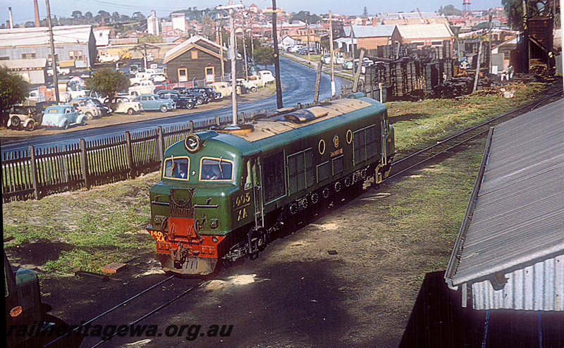 P20422
XA class 1408 in all green livery with cream roof  at East Perth locomotive depot. East Parade in background showing industries in East Perth at time photograph taken.   ER line.
