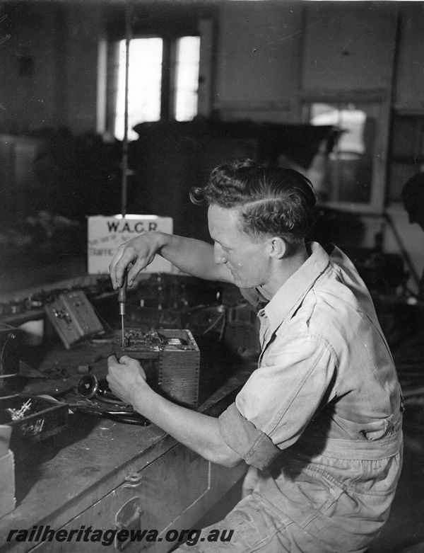 P20443
Electrical fitter, working on telephony equipment, electrical shop, Midland workshops, ER line, close up, interior view
