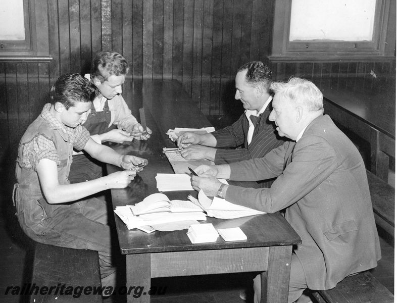 P20448
Railway Institute, Midland Workshops, first Master of Apprentices George Groves (right) and Dudley Blyth with two apprentices undergoing a trade test
