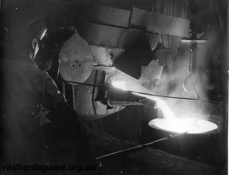 P20449
Birlec arc furnace, pouring molten steel into ladle, operator, foundry, Midland workshops,interior view
