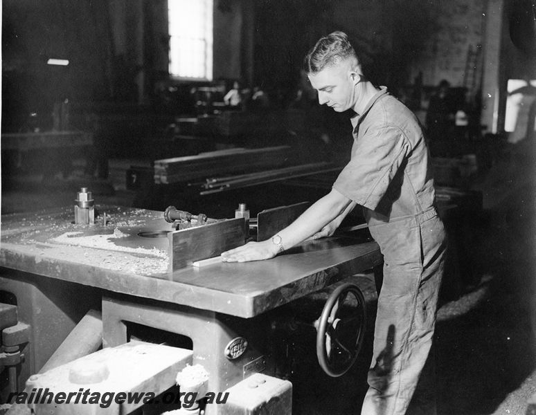 P20452
Worker at bench, profiling a wooden section, wood mill, Midland workshops, ER line, interior view
