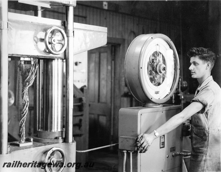 P20456
Avery tester, worker testing a portion of wire rope on the machine, test room, Midland workshops, ER line, interior view
