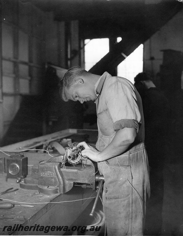 P20458
Worker at bench, vice, armature winding, electrical shop, Midland workshops, ER line, interior view, 
