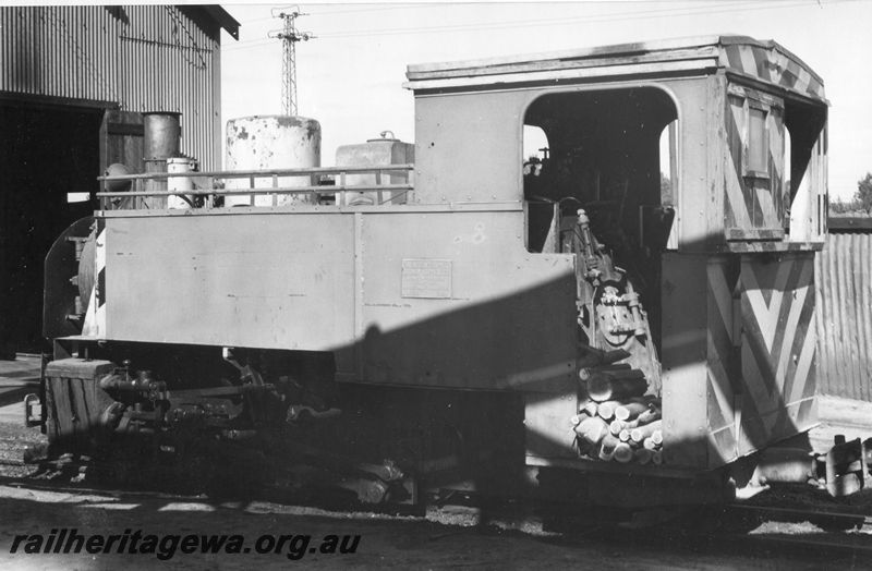 P20472
Great Boulder Gold Mine Orenstein & Koppel tank loco, formerly owned by Lake View and Star Gold Mine, with wood piled on footplate, shed, Fimiston, side and rear view
