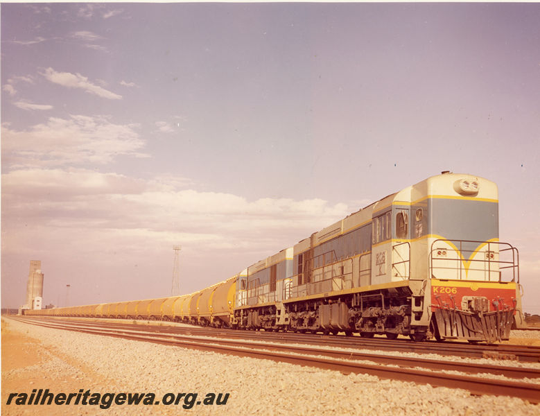 P20502
K class 206, another K class, double heading grain train, wheat silo, tracks, side and front view from trackside
