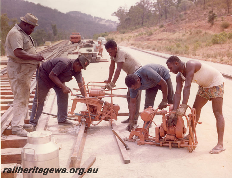 P20514
Work team of men from Thursday Island, cutting rail, machinery, track, Avon Valley line, trackside view
