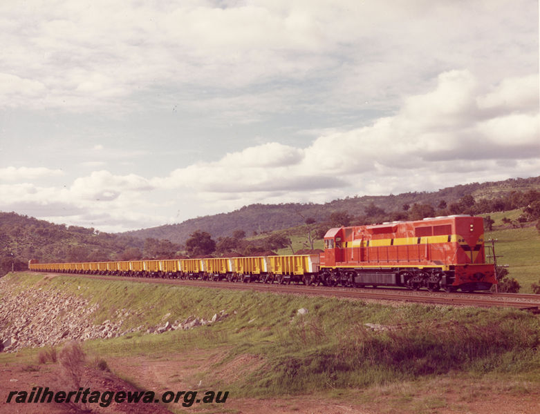 P20515
L class 257 in international orange livery, on single consist iron ore train, rural setting, side and front view
