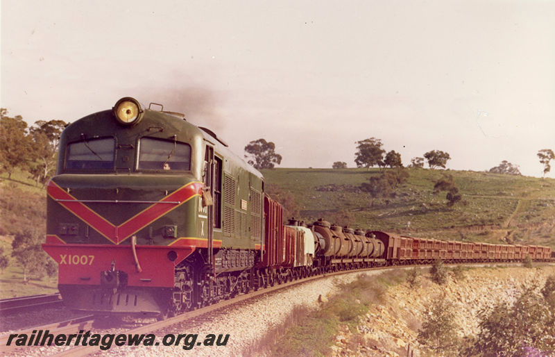 P20516
X class 1007 on goods train, rural setting, Avon Valley line, front and side view
