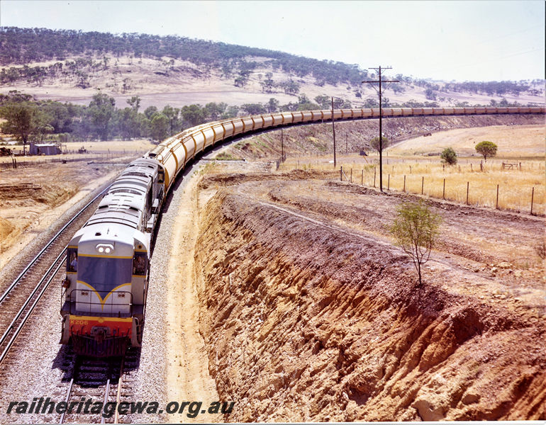 P20521
K class 206, with another K class loco, double heading grain train, cutting, farmlands, departing Toodyay West, Avon Valley line, front and side view from elevated position
