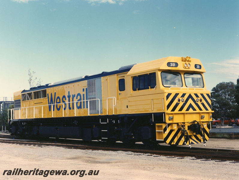 P20540
Q class 301, in Westrail yellow livery, with black stripes and chevrons on end and 