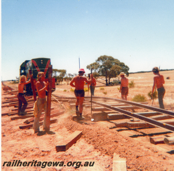 P20541
Track crew at work on track rehabilitation, diesel loco, rails, sleepers, 277m, EM line, trackside view  
