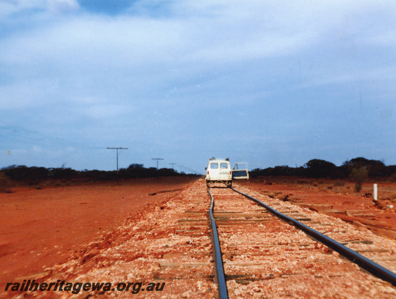 P20542
Motor van fitted with wheels for running on railway tracks, on rails, view from track level
