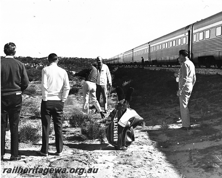 P20599
Railways Of Australia Discovery Tour, passengers playing golf on the Nullarbor, location unknown
