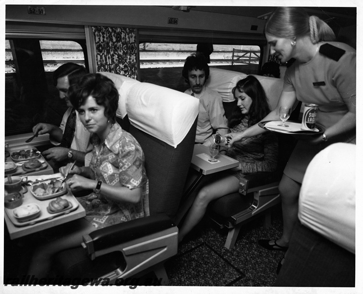 P20603
Stewardess serving passengers aboard the Prospector, publicity photo
